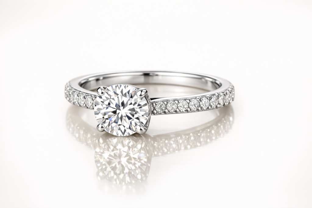 White gold diamond rings with bright rhodium finish on a soft ivory background