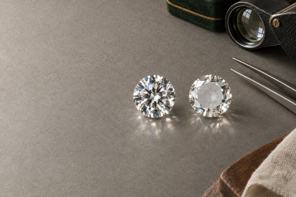 Well-cut round diamond beside a shallow-cut diamond with a dull centre