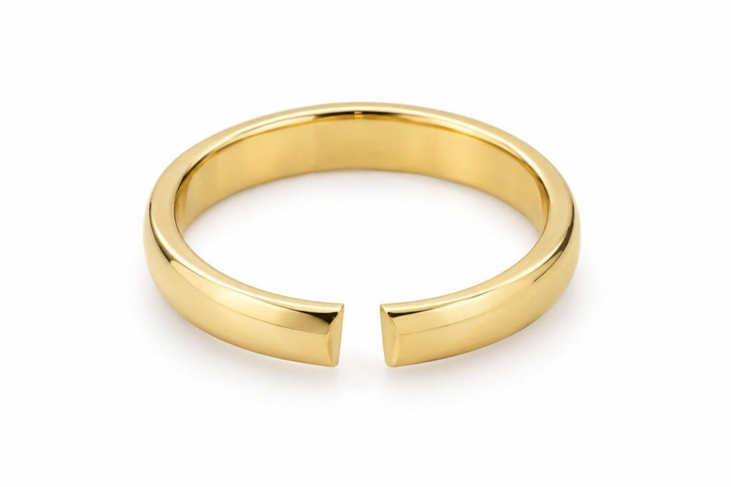 Plain gold band with a small section cut out of the shank, leaving a gap between two clean ends